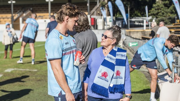 Michael Hooper and a Waratahs member share a chat on Friday.
