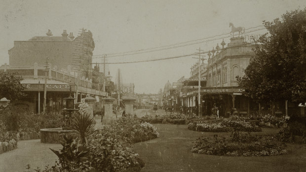 A circa 1910 view of Church Street, Parramatta, facing north from Macquarie Street intersection with St. John's Gardens in the foreground. 