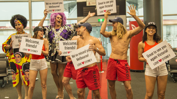 Lifeguards and drag queens greeted the flights from Victoria. 