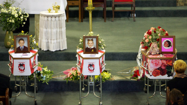 The coffins of Kevin and Jaime Hodges, and Jean Walsh. 