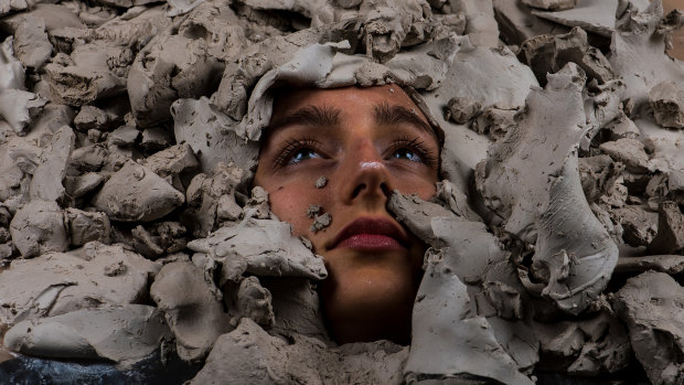 Claire Lambe's Untitled film still (Emily in clay), 2018, C type print.