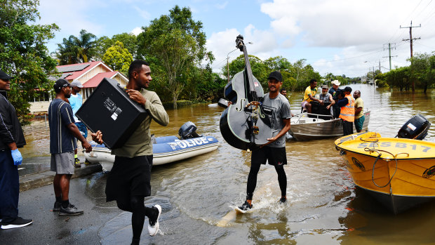 Residents recover whatever goods they can in Lismore, NSW. 