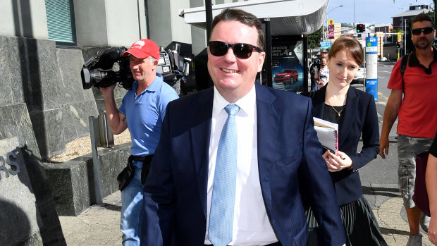 Former Logan City Council mayor Luke Smith (centre) leaves the Brisbane Magistrates Court on Tuesday.