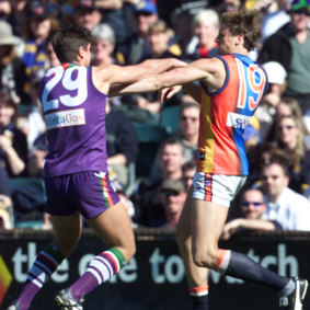 The Docker’s Mathew Pavlich and the Eagle’s Michael Gardner wrestle.