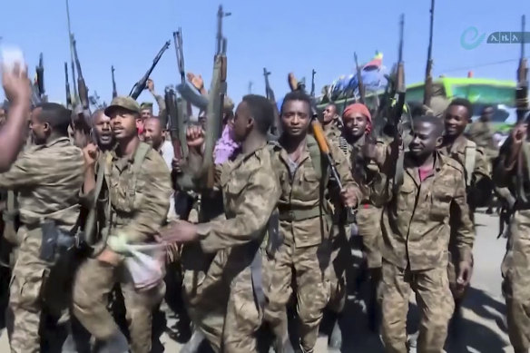 Ethiopian military celebrate near the border of the Tigray region after PM Abiy Ahmed ordered a “final and crucial” military operation against the region’s leadership.