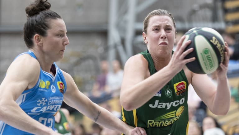 Stars aligned: Dandenongs Sara Blicavs breaks past Canberras Kelsey Griuffin.