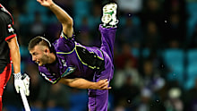 Aaron Summers, right, bowling for the Hobart Hurricanes in 2017. 
