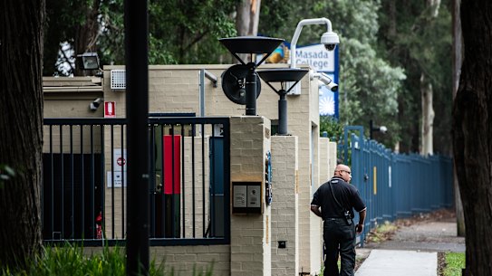 A guard outside a Jewish school in Sydney in January last year.