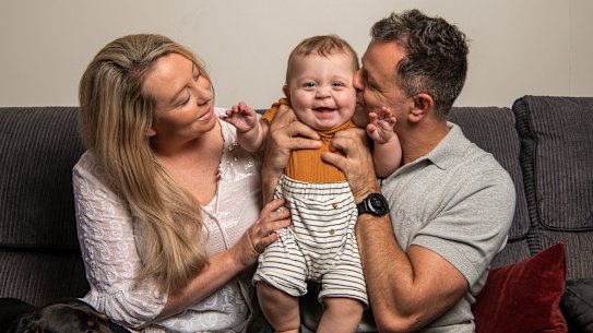 Allie Richards and husband John with 10-month-old Charlie, whose older brother Lenny was stillborn in February 2021.