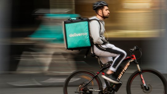 Food delivery rider in Chinatown, Sydney.