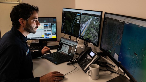 Remote pilot Daniel Scandar flies a drone at Mount White on the Central Coast from a transport centre at Auburn in Sydney on Tuesday.