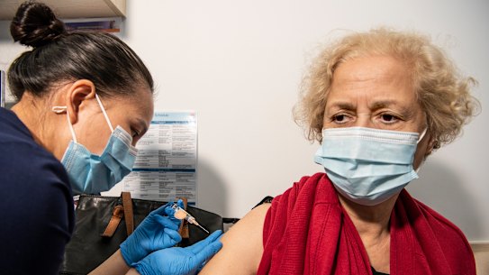 A patient receives her flu vaccination on Thursday. NSW Chief Health Officer Kerry Chant said that influenza immunisation rates “aren’t where they needed to be”.