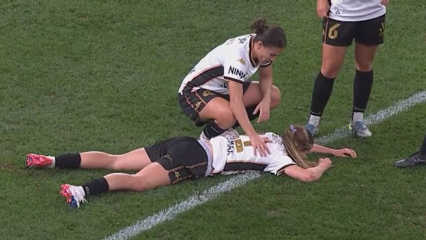 Aideen Keane hits the deck after being collected in the face by Lauren James’ cross.