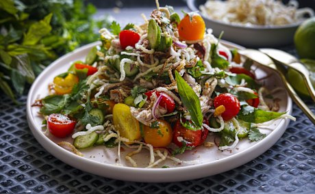 Vietnamese tomato salad with poached chicken and crispy vermicelli. Katrina Meynink Summer one pan recipes for Good Food January 2022. Please credit Katrina Meynink. Good Food use only.
