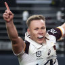 Billy Walters of the Broncos celebrates as Reece Walsh of the Broncos crosses to score a try during the round one NRL match between Sydney Roosters and Brisbane Broncos at Allegiant Stadium, on March 02, 2024, in Las Vegas, Nevada. 