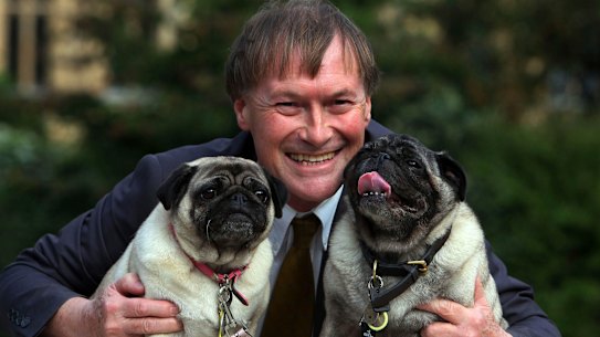 Conservative MP David Amess with his pugs, Lily and Boat.