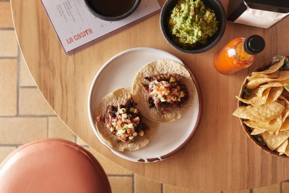 Slow-roasted lamb tacos with zucchini pico de gallo and salsa morita.