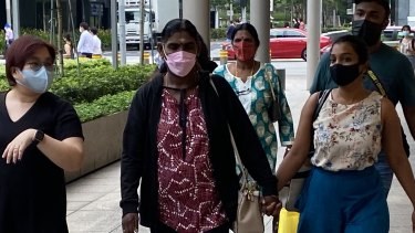 Panchalai Supermaniam, the mother of Nagaenthran Dharmalingam, arrives at court in Singapore on Tuesday with relatives and supporters.