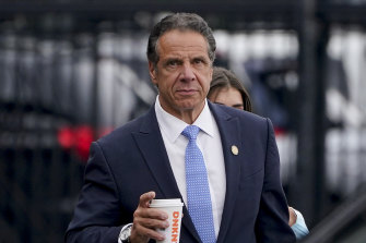 Andrew Cuomo prepares to board a helicopter after announcing his resignation. 