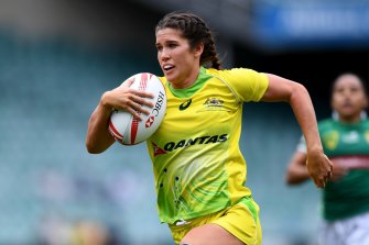 Australia's golden girl Charlotte Caslick on the fly.