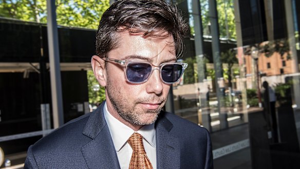 AFR columnist Joe Aston leaving the Federal Court on Monday.