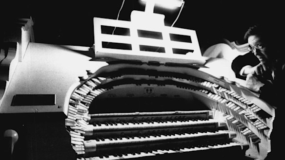 The State Theatre's David Penfold with the  organ in 1991. 