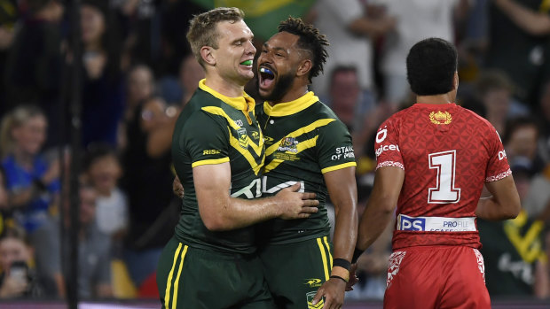 Tom Trbojevic celebrates a try against Tonga with Hamison Tabuai-Fidow.