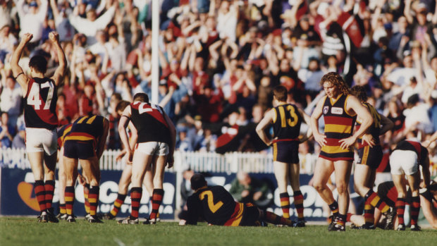 Scenes of dejection on the Crows faces after their loss to Essendon.