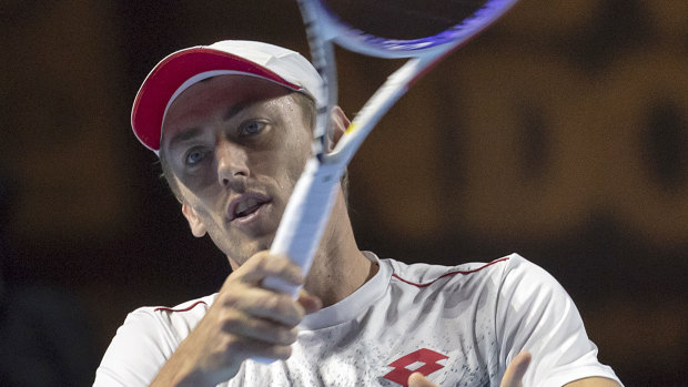 John Millman has been knocked out of the Swiss Indoors in straight sets.