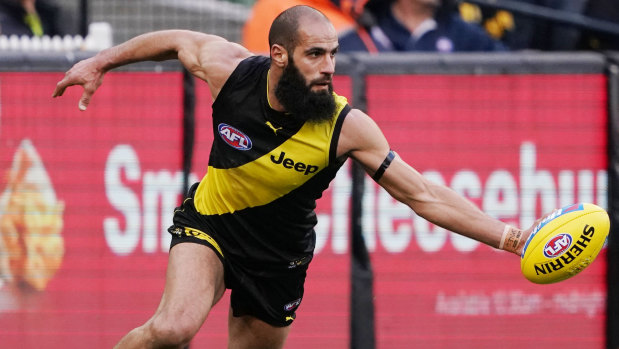 Solid defence: Bachar Houli keeps the ball inside the boundary line for the Tigers.