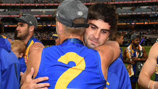 The suspended Andrew Gaff with teammate Mark LeCras after the grand final.