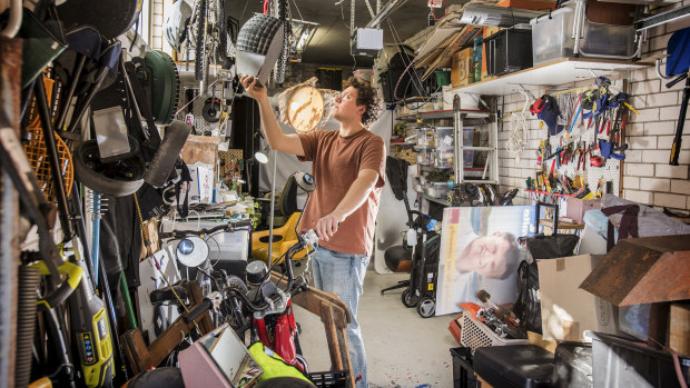 Joel Adler in his parents' garage, which is now his studio.