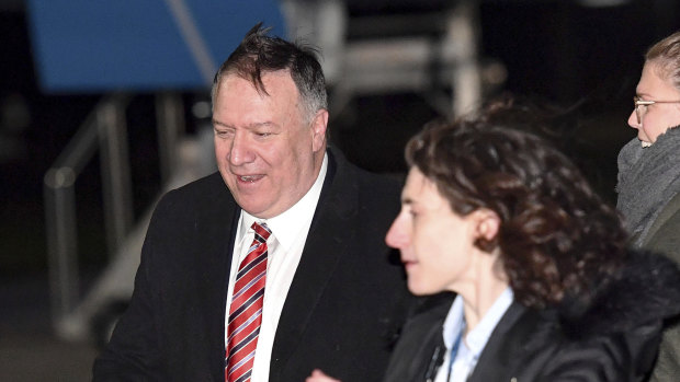 Not happy: US Secretary of State Mike Pompeo, left, after his plane arrived in London.