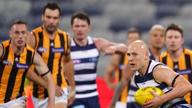 Gary Ablett runs with the ball during the Round 2 clash on Friday night between between the Cats and the Hawks.