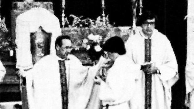 Bishop Ronald Mulkearns officiates at a mass in 1980.