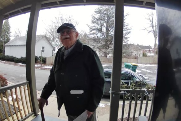 Doug Turner delivering an invitation for his winter party to his neighbour, Michelle Hernandez, in Bucks County, Pennsylvania.
