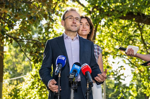 Greens leader Adam Bandt with Senator Steph Hodgins-May in Melbourne’s Treasury Gardens on Monday.