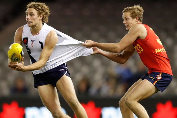 Mitch Hinge (right) tackles Will Brodie in their under-18 days.