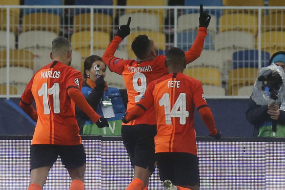 Shakhtar's Dentinho (centre) celebrates after scoring his side's opener against Real Madrid.