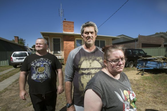 Peter Arthur, Ronald Lyons and Christine Lyons at their home in Kangaroo Flat in the days after Samantha Kelly went missing. She'd been bludgeoned to death in a bungalow at the rear of the property.