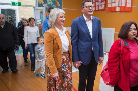 Daniel Andrews and his wife Catherine line up to cast their votes at the 2018 state election.