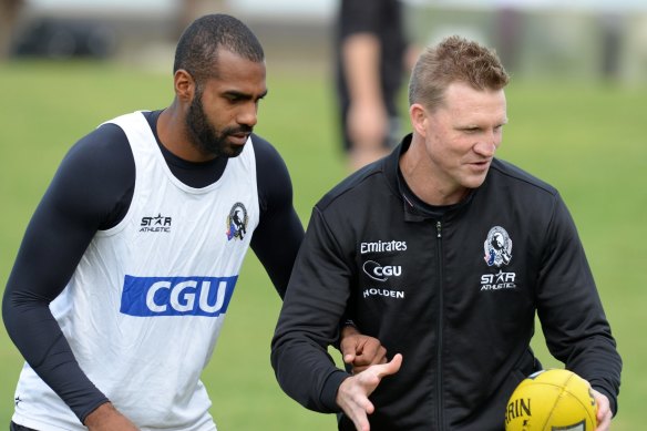 Heritier Lumumba with Nathan Buckley at a Collingwood training session in 2014.