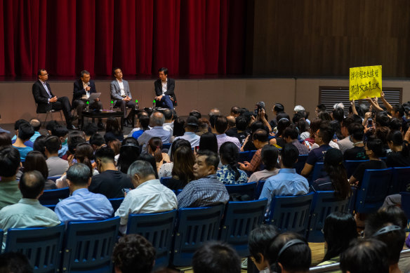 Students hold a banner as vice-chancellor Rocky Tuan Sung-Chi holds an open meeting with students of Hong Kong Chinese University earlier this month.
