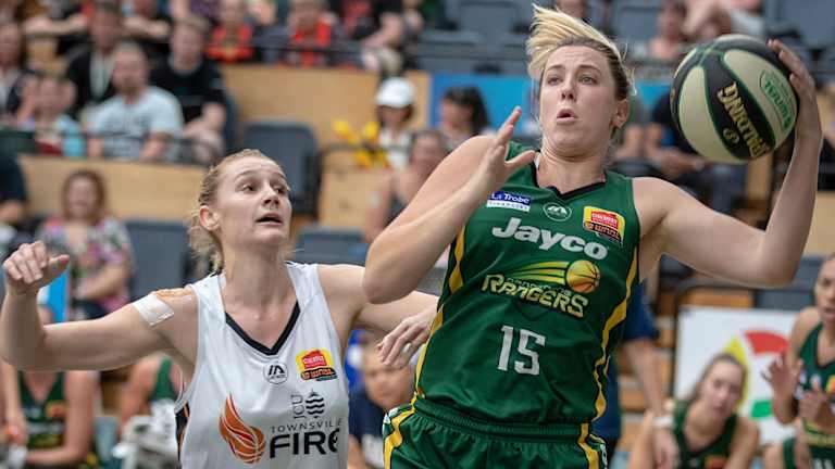 Safe hands: Rangers Sara Blicavs hauls in a rebound against Townsville’s Darcee Garbin. 