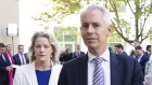 Clare O’Neil and Andrew Giles depart the press conference after telling the gathered media they had to go to a division in the House.