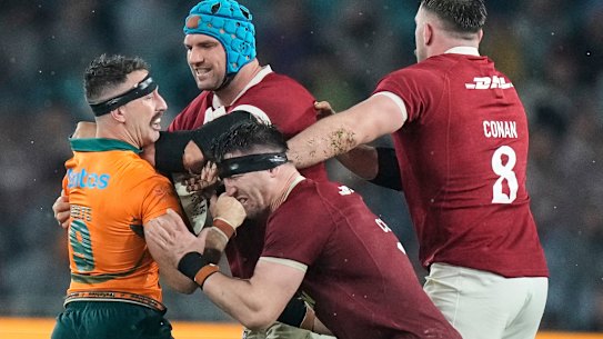 Australia’s Nic White, left, clashes with Tadhg Beirne, Tom Curry and Jack Conan .