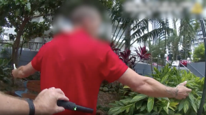 Queensland Police officers search people with metal detection wands under an earlier trial of the increased powers in Gold Coast party precincts.