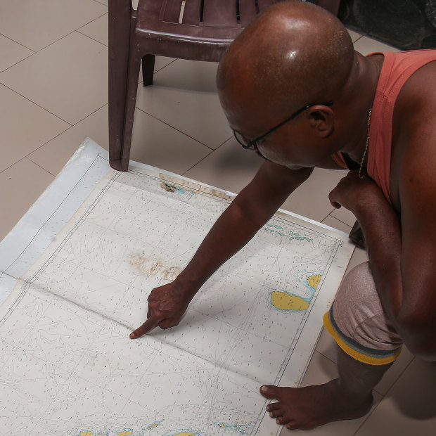 Fernando outlines the route towards Australia on a nautical chart.