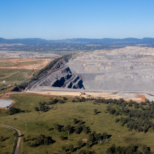 The Mount Pleasant mine, far left, and Bengalla mine, right, with the town of Muswellbrook in the distance.