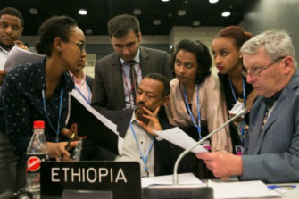 Dr Ian Fry (right) engaged in climate negotiations on behalf of Tuvalu in 2017.